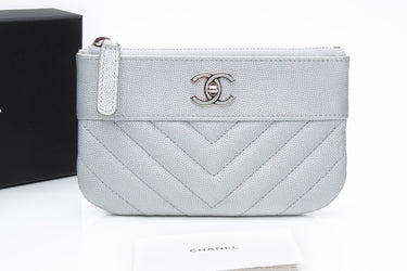 CHANEL Metallic Silver Caviar Chevron Quilted Small Mademoiselle Zip Pouch Case