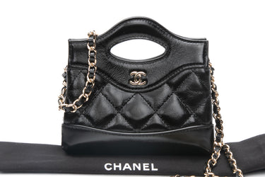 CHANEL Black Shiny Lambskin Quilted Micro 31 Clutch with Chain