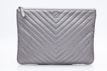 CHANEL Silver Chevron Quilted Lambskin O Case Clutch
