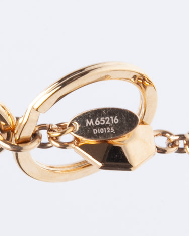 Louis Vuitton Goldtone Metal LV Facettes Key Holder and Bag Charm - Yoogi's  Closet