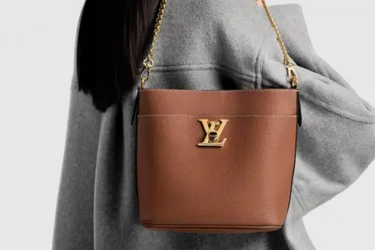 LOUIS VUITTON Cognac Lock and Walk Bag